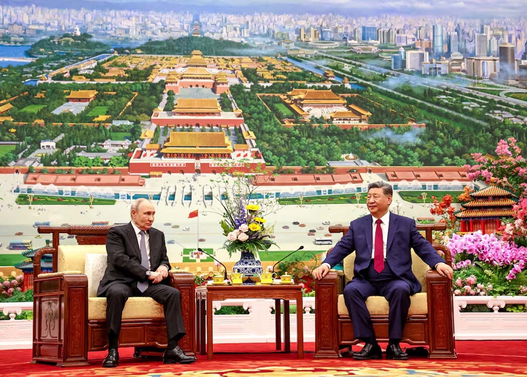 Russian President Vladimir Putin and Chinese President Xi Jinping have tea following their meeting at the Great Hall of the People in Beijing, China May 20, 2026. (Image courtesy of Sputnik/Alexander Kazakov)