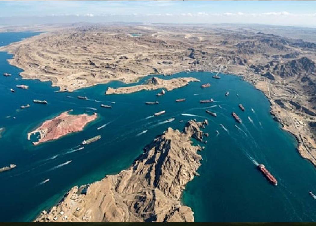 Cargo ships moving through the Strait of Hormuz amid global food security and fertilizer supply concerns