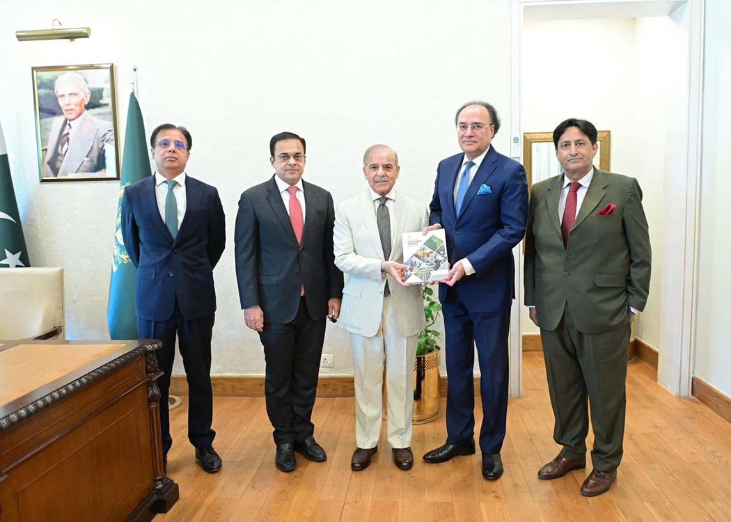 Federal Finance Minister Muhammad Aurangzeb presents a copy of the Economic Survey Report 2025-26 to Prime Minister Shehbaz Sharif in Islamabad.